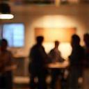 People gathered in a creative workshop setting