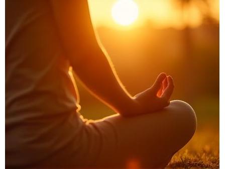 Calm person meditating outdoors at sunrise
